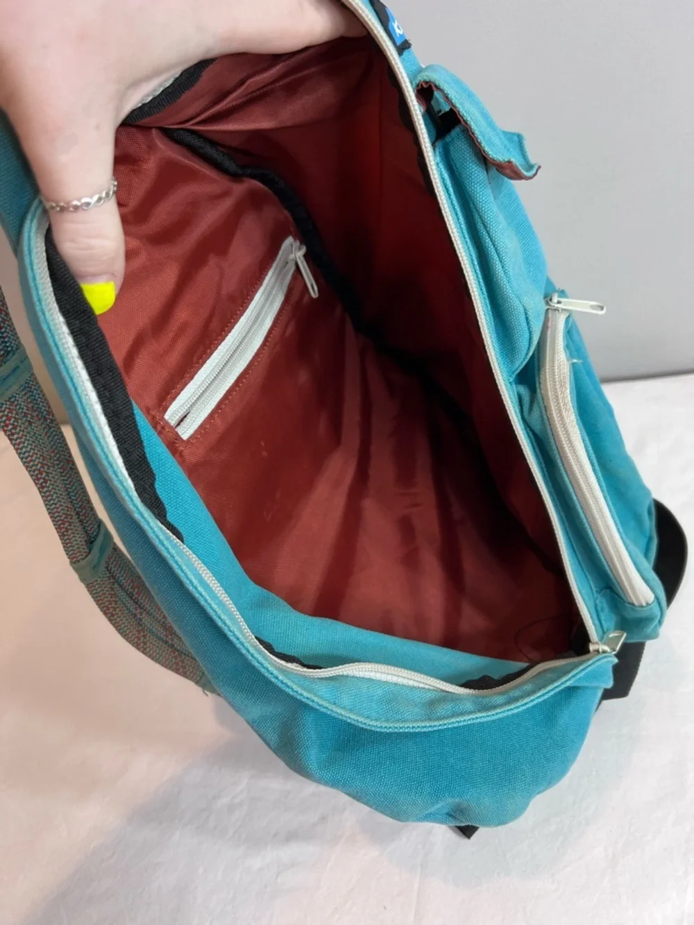 Kavu teal rope sling bag backpack